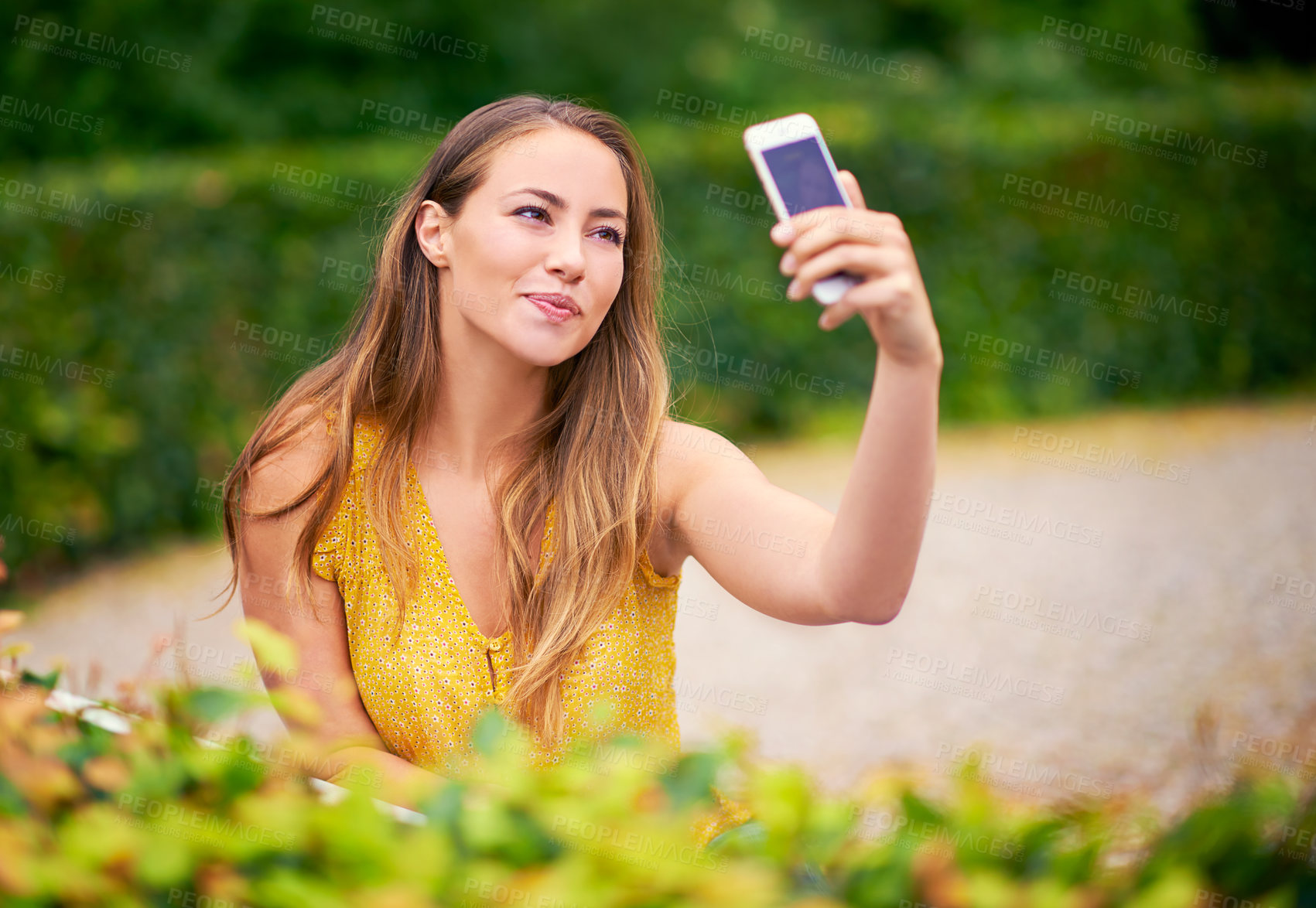 Buy stock photo Outdoor, relax and woman with selfie in garden for memory, photograph or social media update. Nature, smile and person with happiness for online post, profile picture or peaceful weekend in park