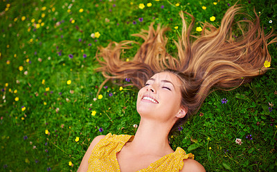 Buy stock photo Top view, relax or woman on grass, flowers or freedom with happiness, care or healthy. Female person, natural or happy lady with a smile, carefree or wellness outdoor, nature or spring time with hair
