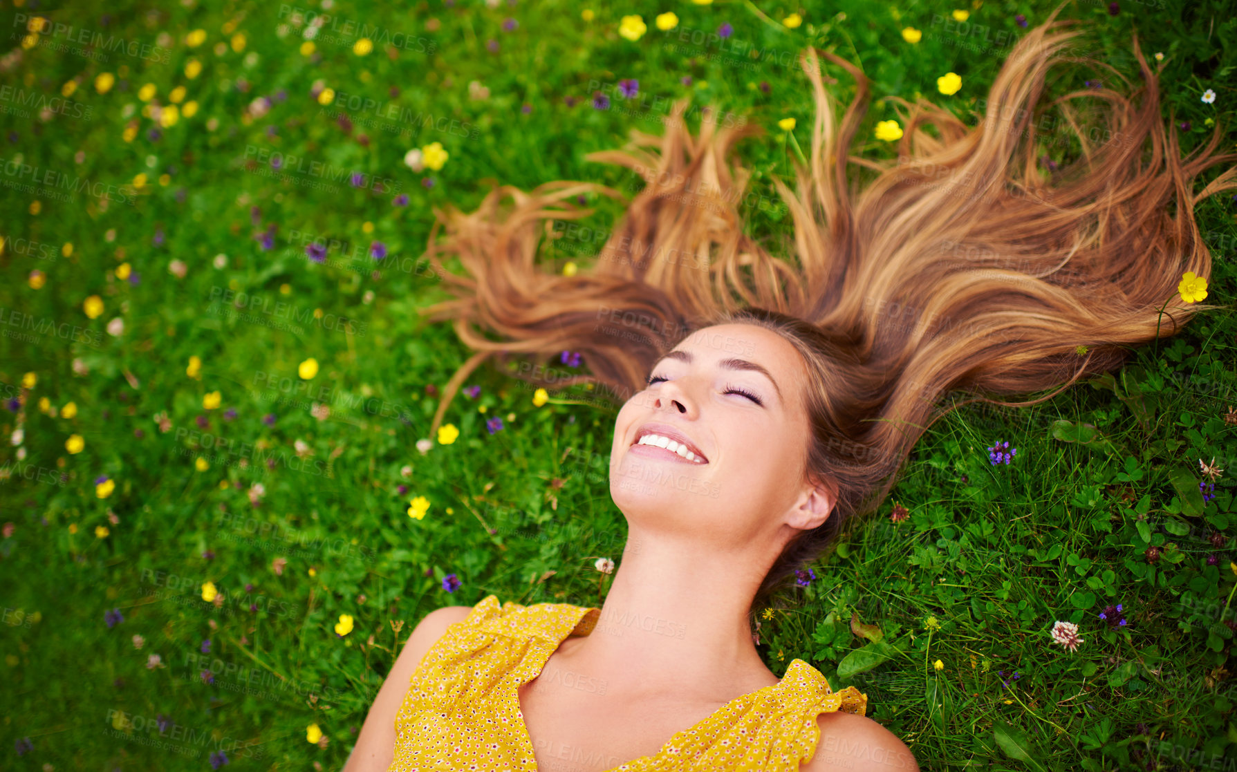 Buy stock photo Top view, relax or woman on grass, flowers or freedom with happiness, care or healthy. Female person, natural or happy lady with a smile, carefree or wellness outdoor, nature or spring time with hair