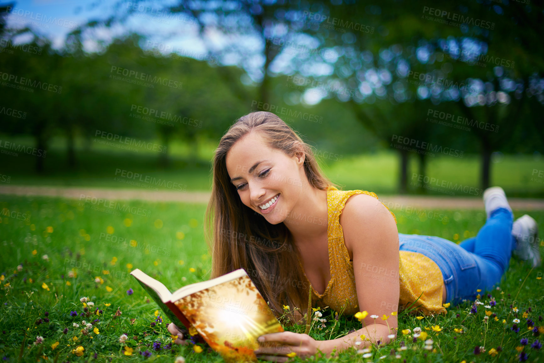 Buy stock photo Nature, reading and woman relax with book on grass for learning, knowledge or weekend break. University, student and person lying in field with hobby for literature, happiness or peace in garden