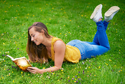 Buy stock photo Woman, book and reading in nature for relax, story telling or fantasy adventure in field. Female teacher, smile or novel on grass for magical tale, interesting literature or inspiration in Australia