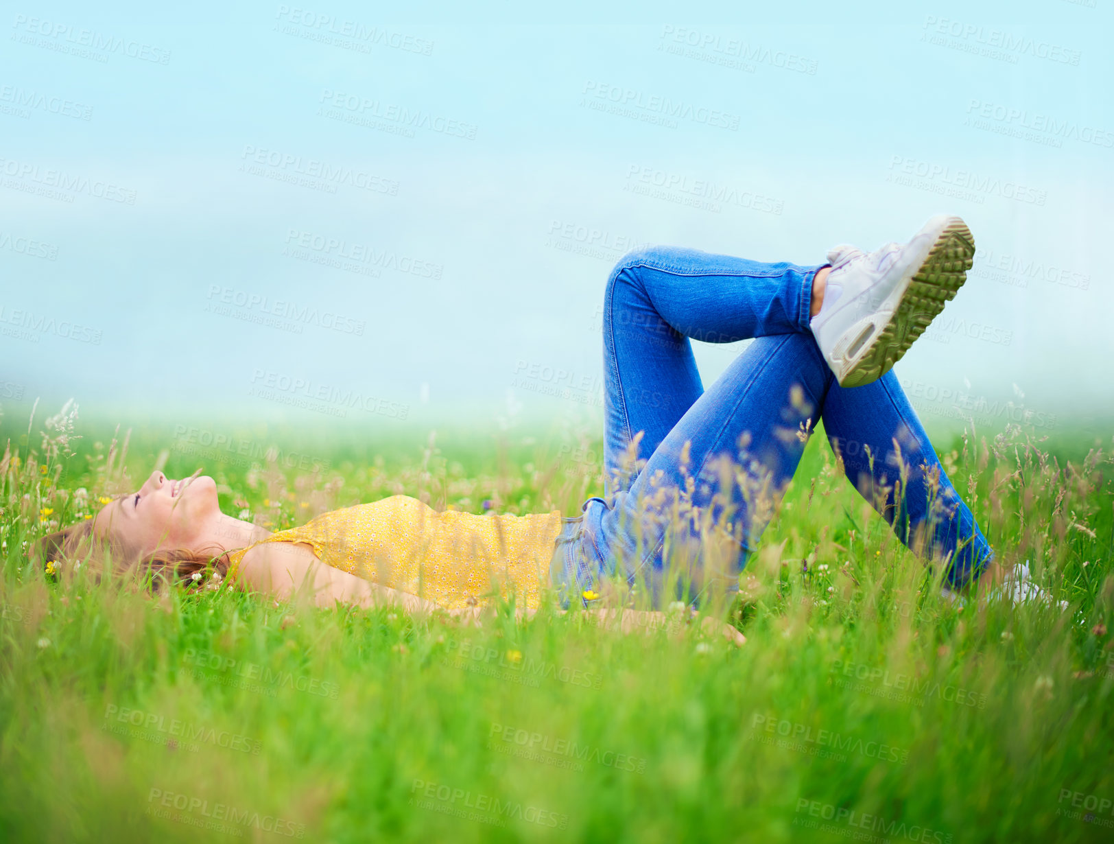 Buy stock photo Woman, relaxing and grass in nature field, calm and happiness in spring for weekend break in country side on holiday. Laying, sleep and resting on ground, female person and peaceful outside
