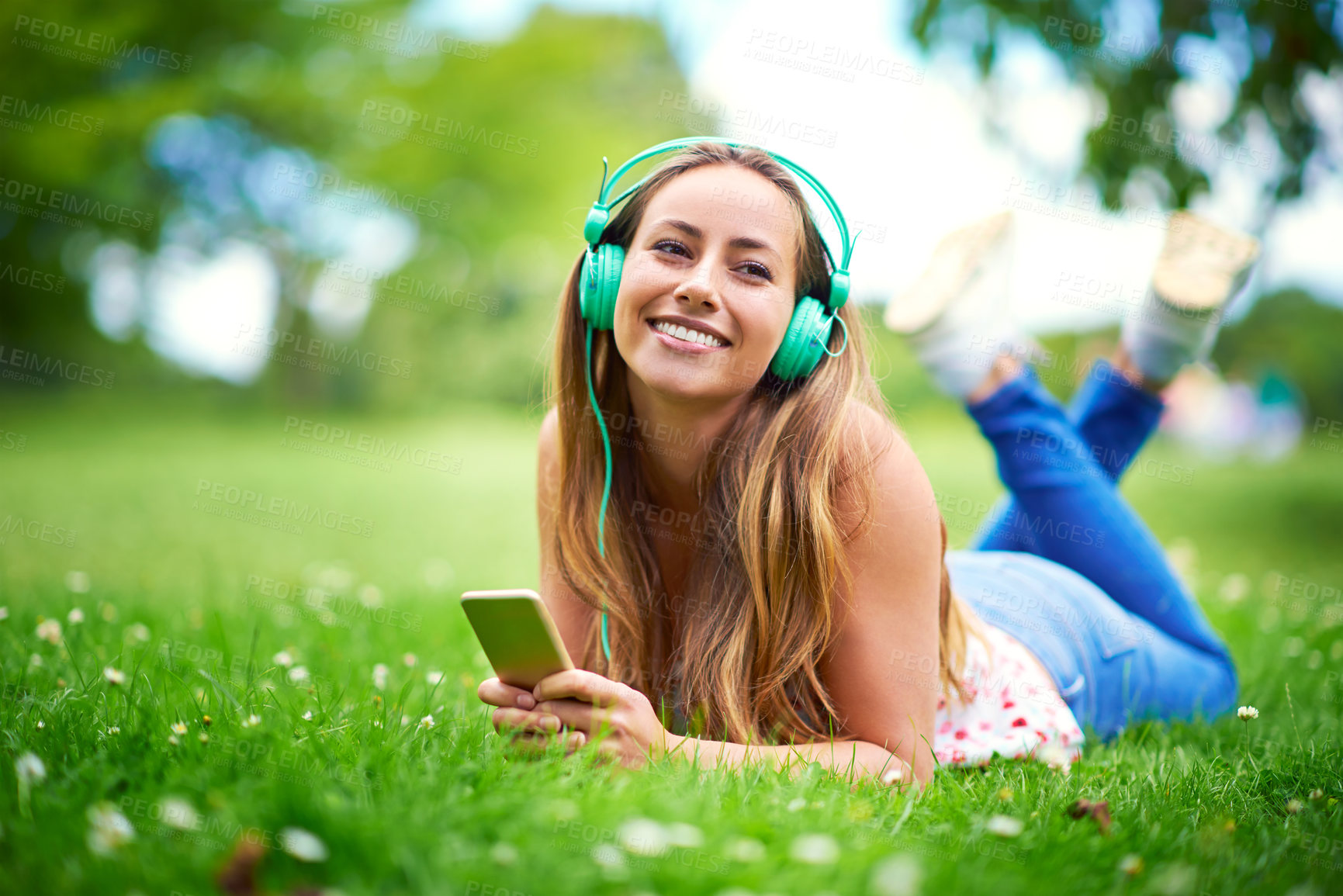 Buy stock photo Relax, woman and headphones on grass for education, audio book and podcast or media. College student, smartphone and happy on campus or backyard for network, online and music for thinking or studying