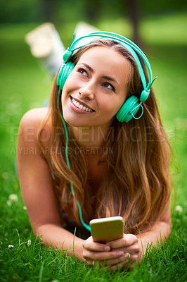 Buy stock photo Thinking, woman and headphones on grass for music, streaming and audio book or podcast. College student, smartphone and memory on campus or field for networking, online or media for education in park