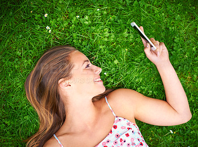 Buy stock photo Shot of a young woman spending time at the park