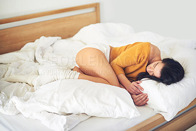 Buy stock photo Full length shot of a young woman sleeping on her bed