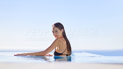 Buy stock photo Shot of a young woman in a swimming pool