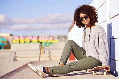 Buy stock photo Sunglasses, smile and woman with skateboard in city by wall in summer for sport, leisure and relax outdoor. Happy person, skate park and gen z girl in cool clothes for trendy fashion in South Africa