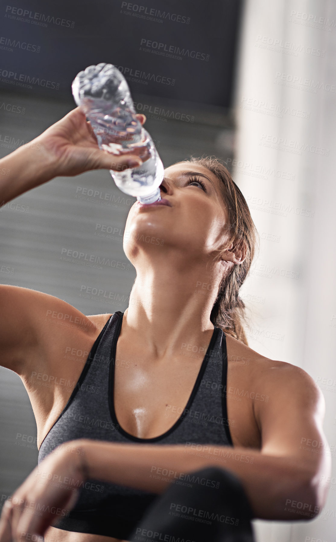 Buy stock photo Woman, thirsty and gym with drinking water bottle for hydration with training for health or cardio. Exercise, wellness and muscle recovery for athlete, liquid and refresh with runner in Germany.