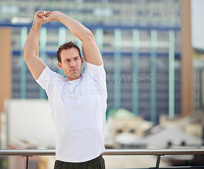 Buy stock photo Cropped shot of an athlete warming up before a workout