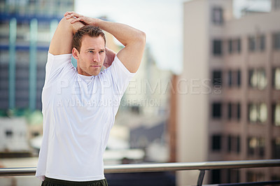 Buy stock photo Cropped shot of an athlete warming up before a workout