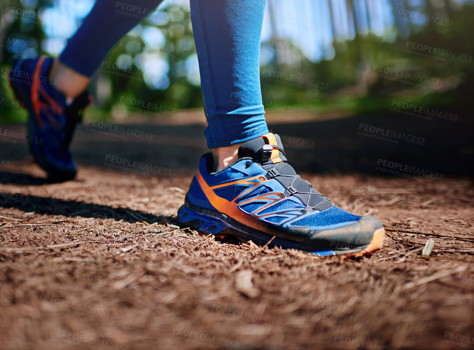 Buy stock photo Person, shoes and walking in forest for exercise with strong body, wellness and outdoor sports. Athlete, feet zoom and sneakers in woods for nature training, cardiovascular workout and trail path