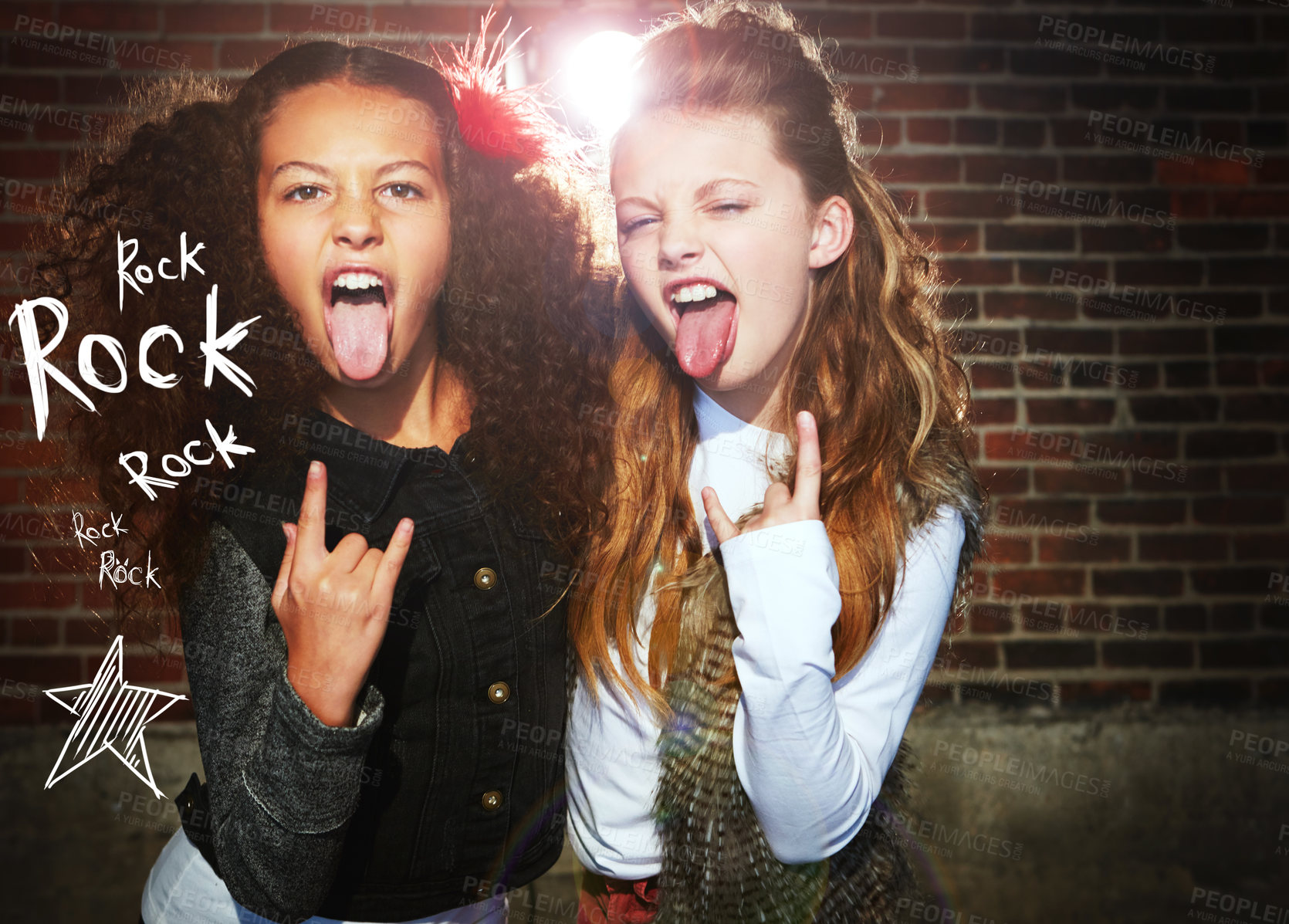 Buy stock photo Shot of two girls pulling faces and making a rock gesture