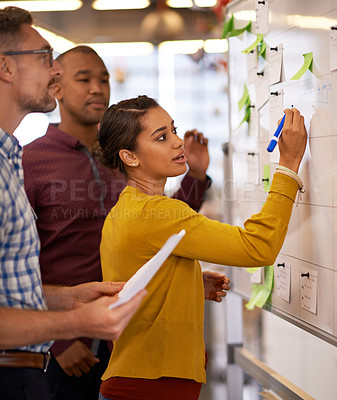 Buy stock photo Woman, focus and brainstorm on whiteboard or marketing presentation or male employees and in office. Coach, lady trainer and man workers or flip chart or business project and  workplace meeting