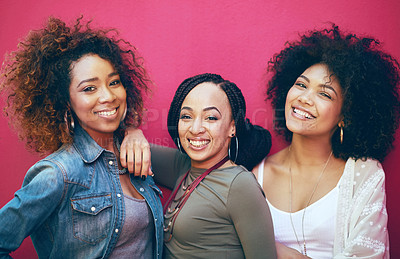 Buy stock photo Portrait of a group of female friends posing against a pink background