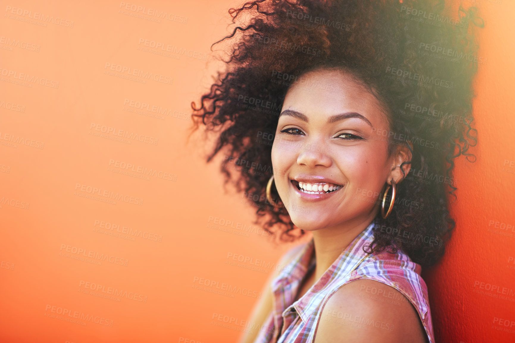 Buy stock photo Shot of an attractive young woman posing against a colorful background