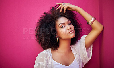 Buy stock photo Portrait of an attractive young woman posing against a pink background