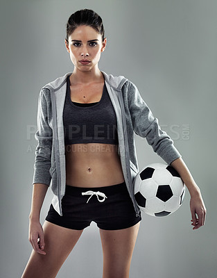 Buy stock photo Studio shot of a sporty young woman against a gray background