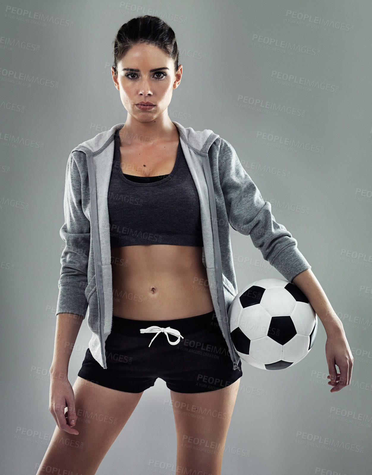 Buy stock photo Studio shot of a sporty young woman against a gray background