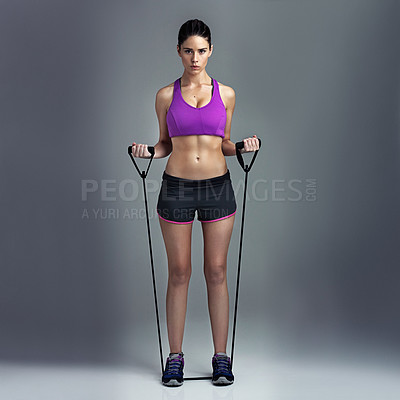 Buy stock photo Woman, portrait and resistance band in studio for exercise, stretching training and gray background. Female person, workout and gym equipment for fitness, strong muscle and athlete for tough wellness