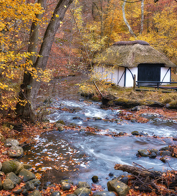 Buy stock photo 250 years old public fishing house by the river  in the colors of autumn