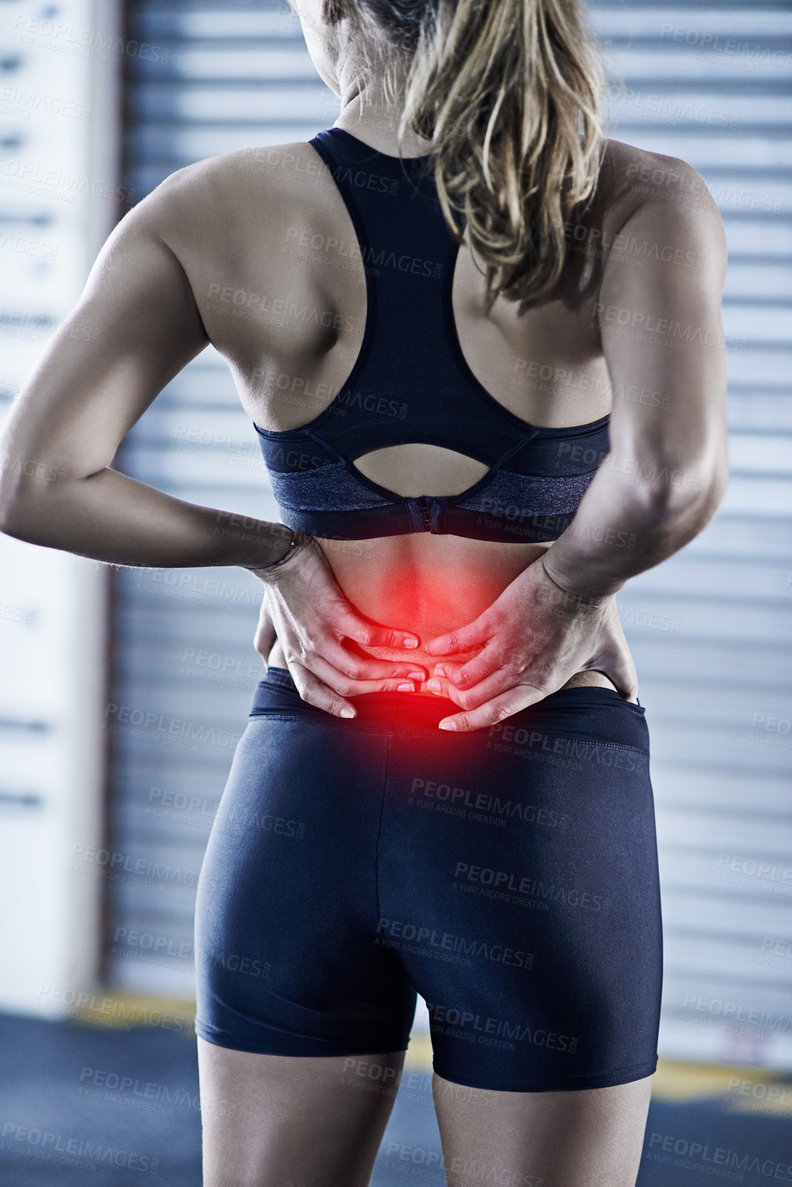 Buy stock photo Woman, fitness and back pain with red glow for injury, accident or bruise after workout or exercise at gym. Rear view of female person with sore spine, ache or inflammation for hurt joint or muscle