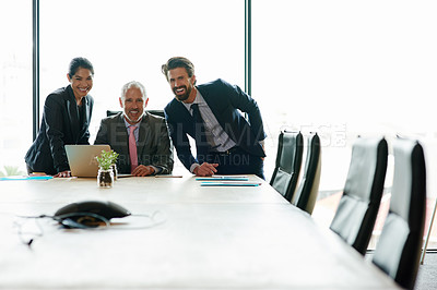 Buy stock photo Group of happy corporate businesspeople planning ideas. Executives leading brief with multiple colleagues, communicating and interacting in office during a group meeting in a boardroom.