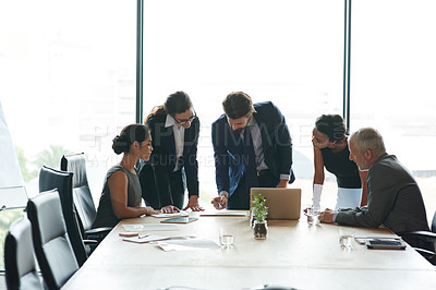 Buy stock photo Group of businesspeople planning an innovation project together as a team in a collaboration meeting in a modern boardroom office. Professional executives in discussion about a creative strategy idea