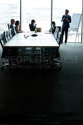 Buy stock photo Presenting, planning and international leading businesspeople sharing ideas in a group meeting. Businessman leader briefing, communicating and interacting with colleagues in office.