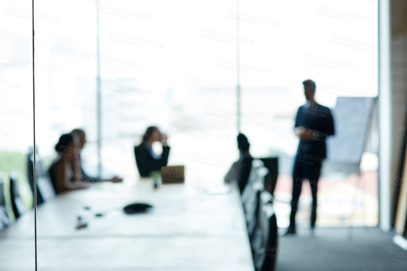 Buy stock photo Shot of a group of executives having a meeting in a boardroom