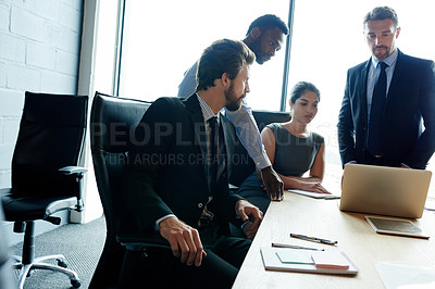 Buy stock photo Shot of a group of executives having a meeting in a boardroom