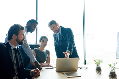 Buy stock photo Cooperation, laptop and business people in meeting, conversation and brainstorming with internet. Group, coworkers and employees in boardroom, pc and feedback for company website, ideas and teamwork