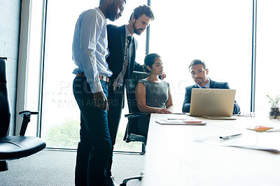 Buy stock photo Teamwork, trust and good leadership during a meeting while using a laptop for innovation and marketing research in an office. Corporate and motivated businesspeople discussing their company vision