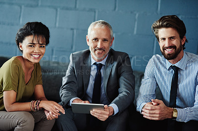 Buy stock photo Portrait of a group of coworkers working together with a digital tablet