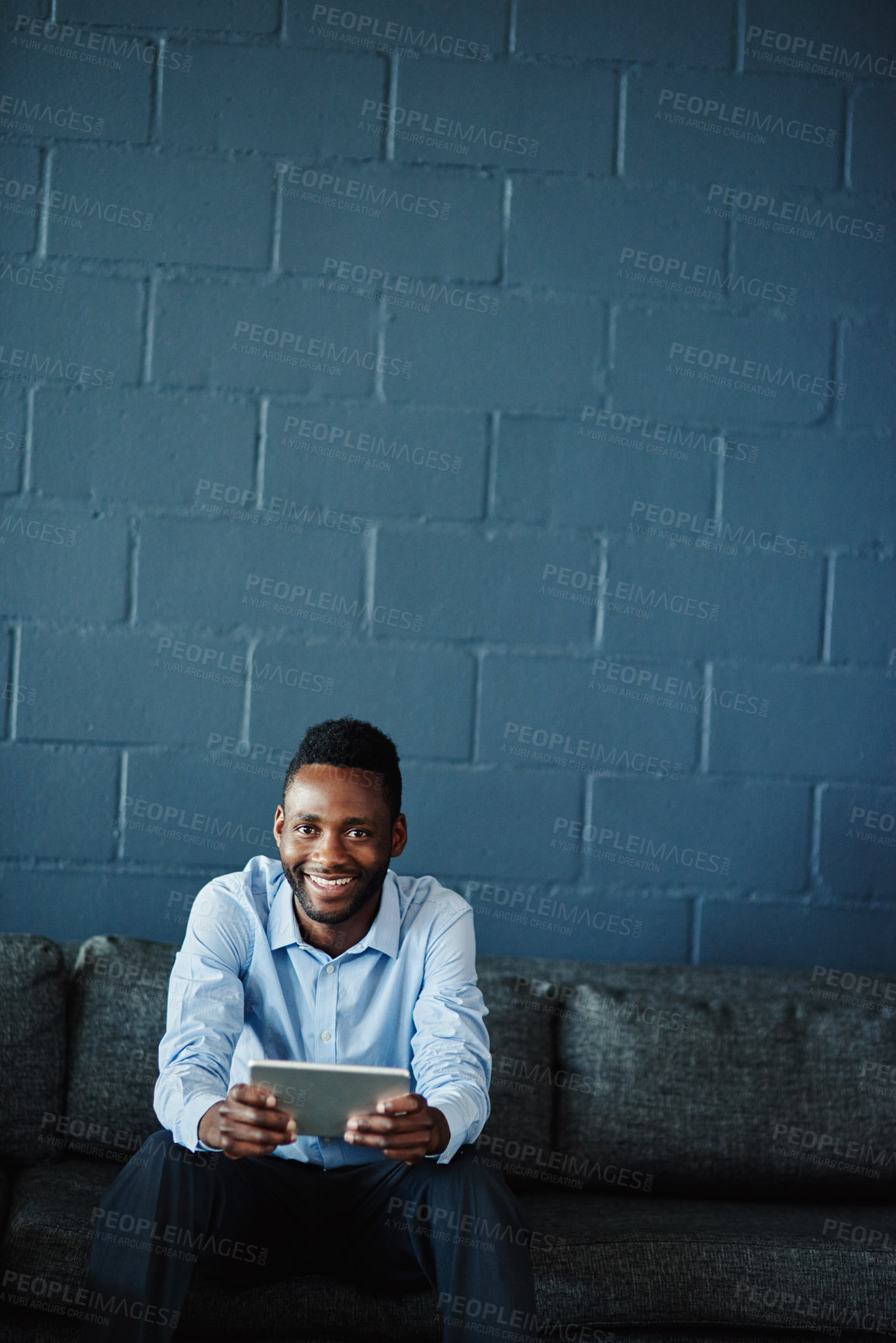 Buy stock photo Portrait of a businessman using a digital tablet