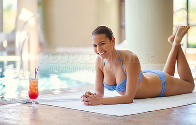 Buy stock photo Woman, portrait and bikini poolside at spa for holiday, vacation and luxury wellness at resort with cocktail. Happy person, tourist and relax on towel for travel, drinks and resting on summer getaway