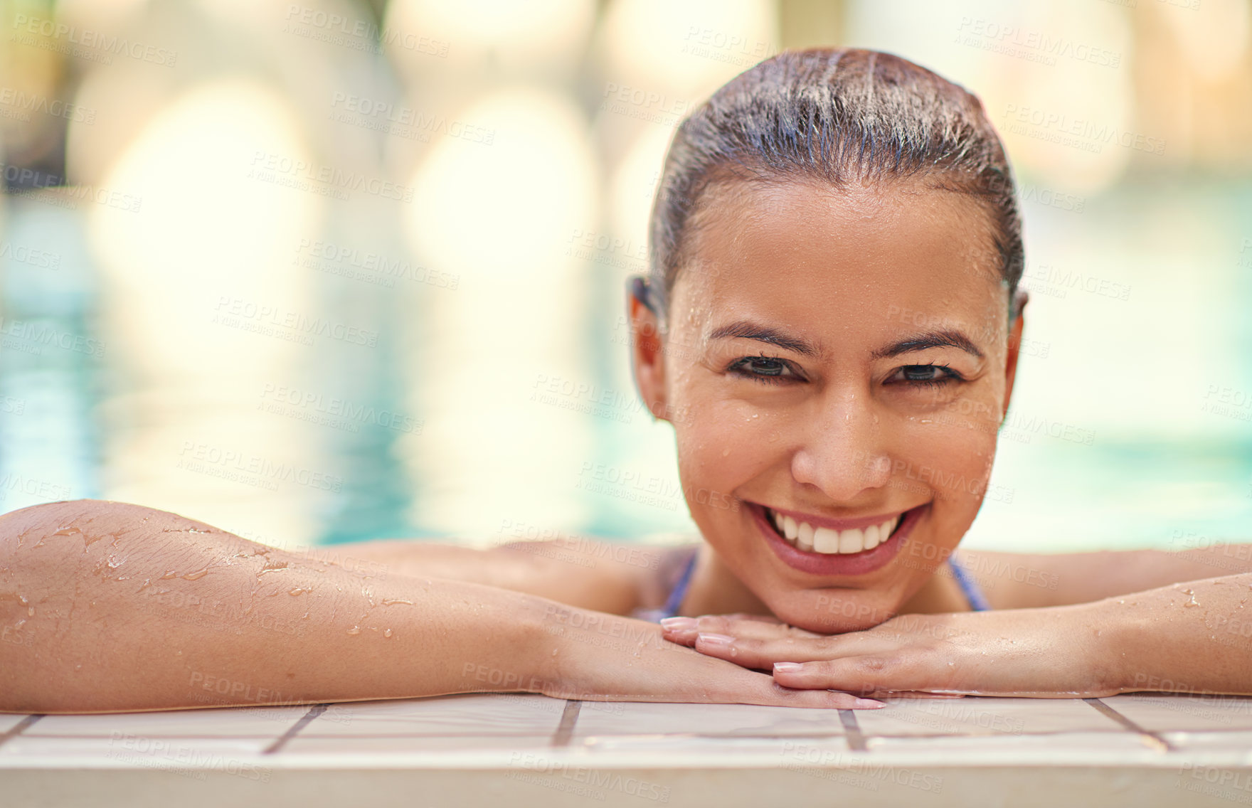 Buy stock photo Shot of a young woman relaxing in the pool at a spa