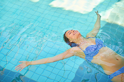 Buy stock photo Swimming pool, happy and woman float in water on holiday, vacation and weekend at hotel resort. Luxury hospitality, travel and person with smile for wellness, relax and resting at spa to chill