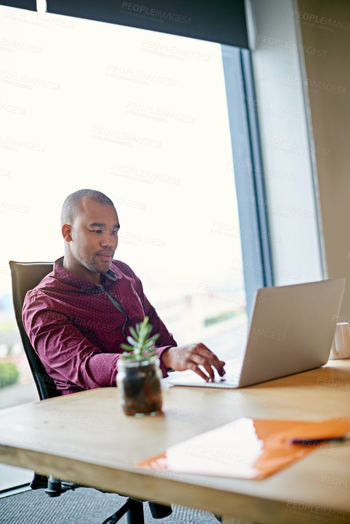 Buy stock photo Business man, laptop and thinking at startup, reading and decision for review with planning for project management. Person, computer and smile with proposal, feedback and choice at creative agency