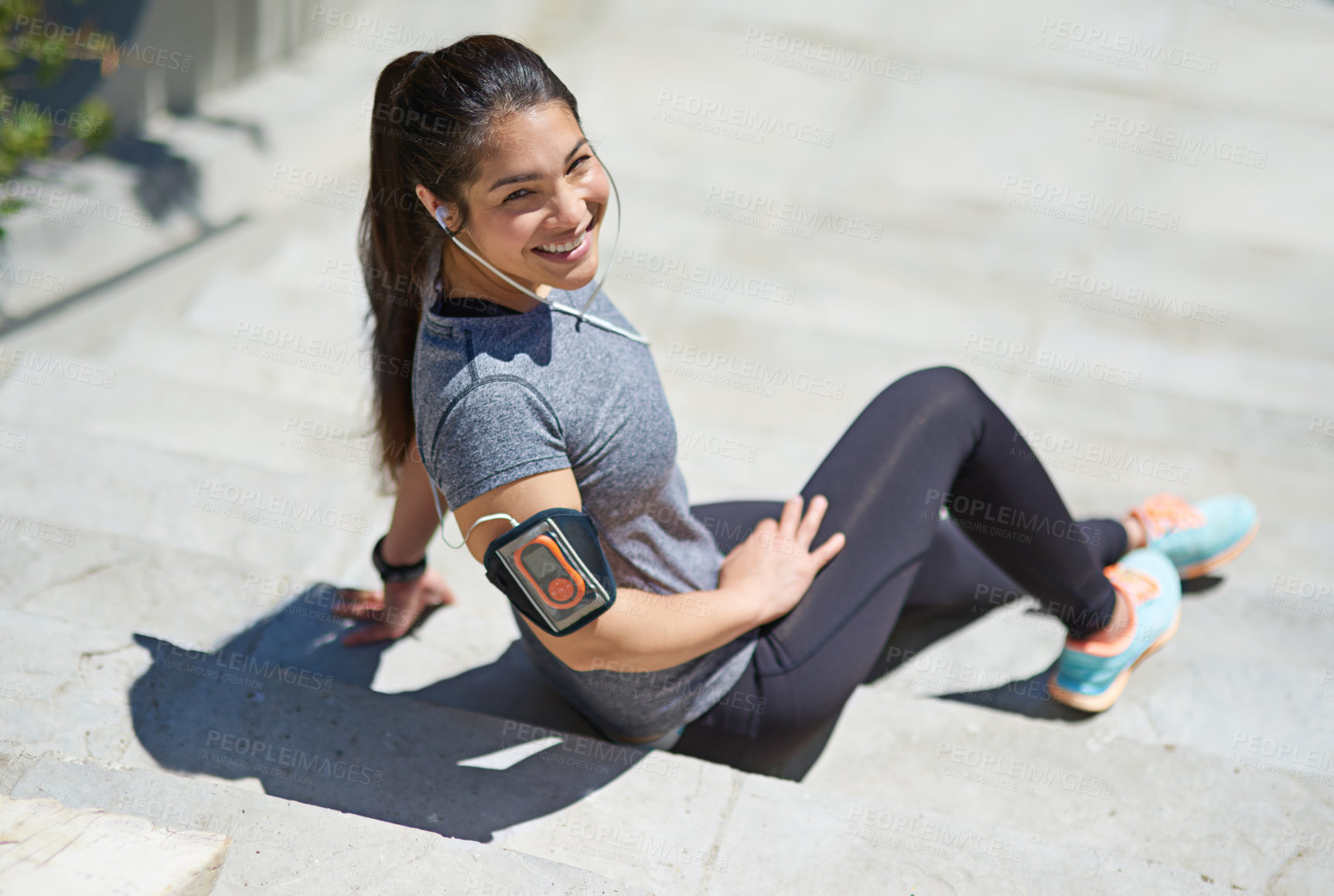 Buy stock photo Happy woman, portrait and fitness with earphones on stairs for break, relax or listening to music in city. Female person with smile or headphones on steps for podcast, playlist or audio after workout