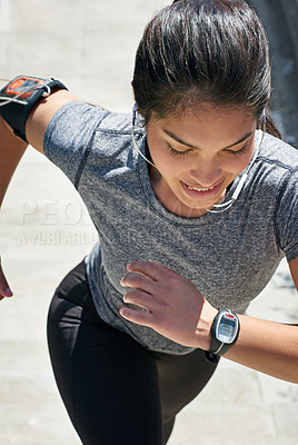 Buy stock photo Shot of a fit young woman running up a flight of stairs