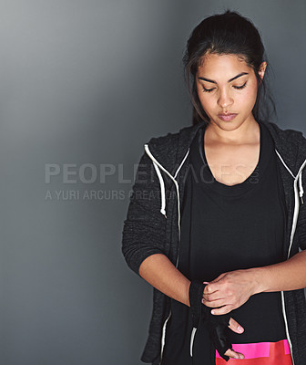 Buy stock photo Studio shot of a fit young woman in sports clothing