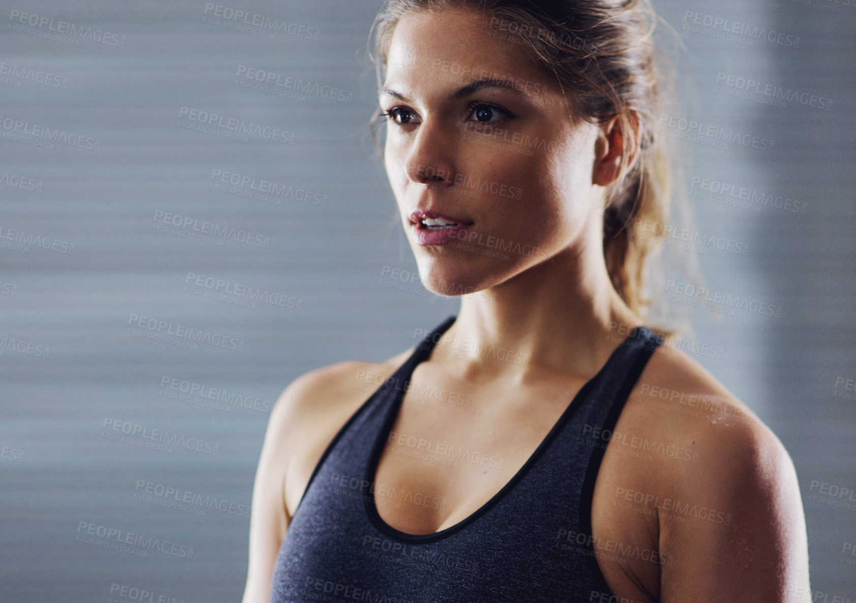 Buy stock photo Cropped shot of a young woman working out