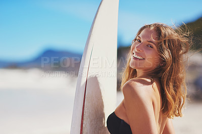 Buy stock photo Portrait of a young surfer standing on the beach