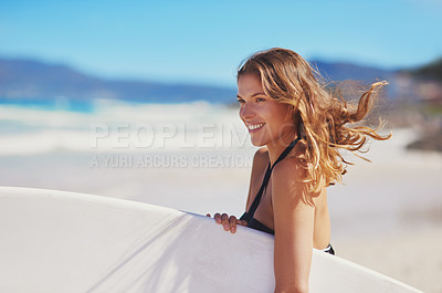 Buy stock photo Shot of a young surfer at the beach