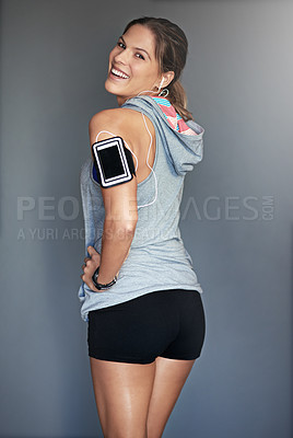 Buy stock photo Portrait of a sporty young woman posing against a gray background