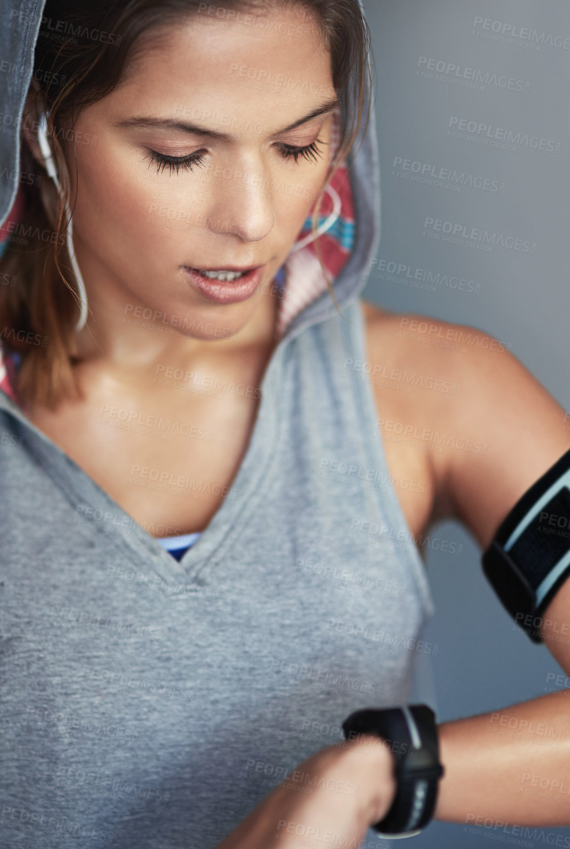 Buy stock photo Woman, watch and tired with heart rate check, wellness and fitness progress with health app and program. Music, blood pressure and workout with training and exercise in studio with time `and break