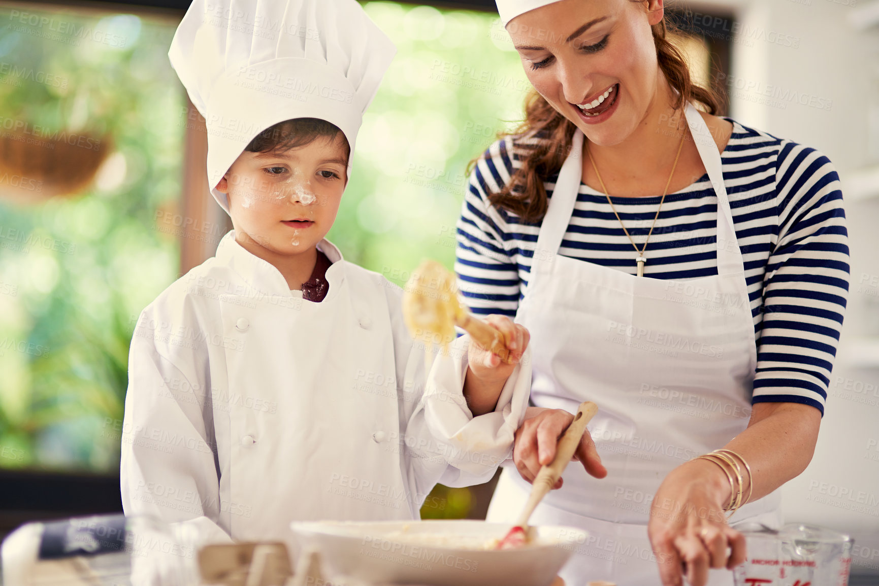 Buy stock photo Kitchen, mother and kid mixing, baking and learning with dough, prepare ingredients or culinary skills. Woman, home and playful boy for joy, cooking and child development for recipe or breakfast help