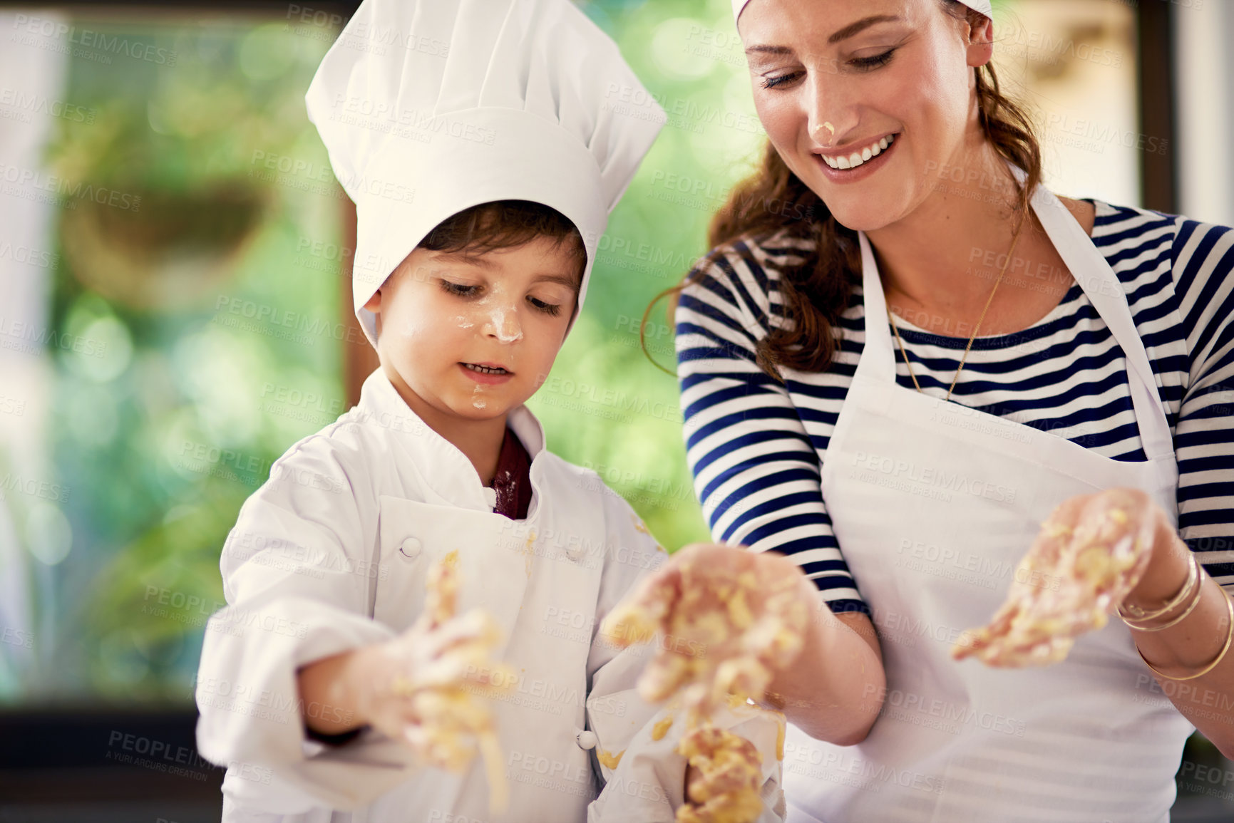 Buy stock photo Mom, boy and smile with baking as chef in kitchen for role play, fun and child development. Family, parent and kid at home with dough for dessert with teaching skills for bonding, support and care