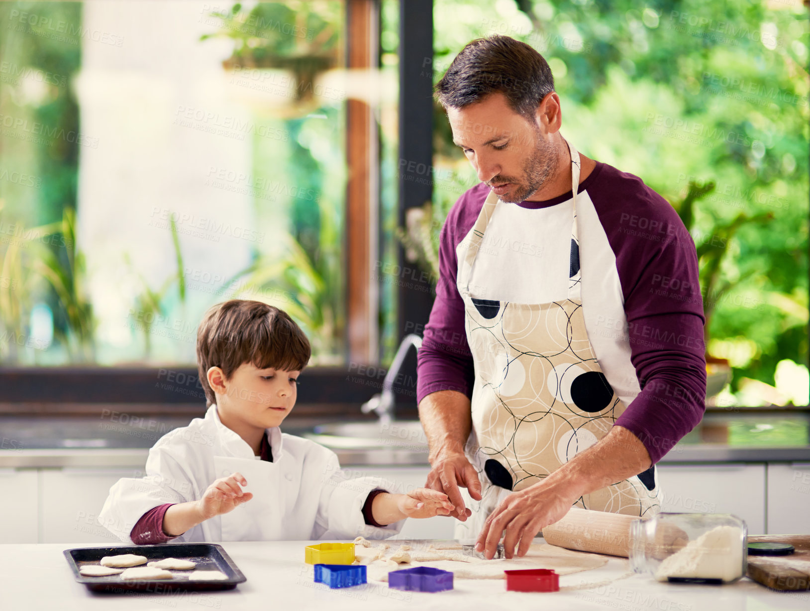 Buy stock photo Dad, boy and help with dough for baking in kitchen for role play, fun and child development or growth. Family, parent and kid at home for dessert with learning for bonding, support and care 